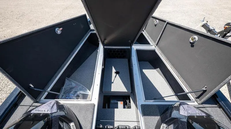 Slide: The Image of 2024 Lund 1875 Pro-V Bass XS boat storage compartments open. - 17
