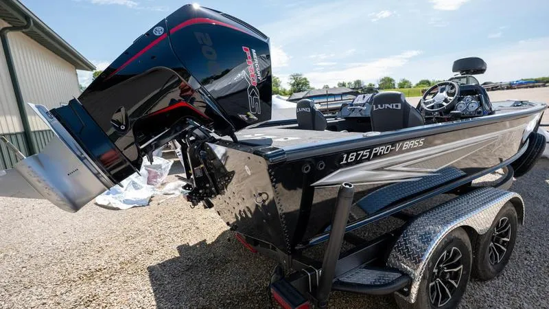 Slide: The Image of 2024 Lund 1875 Pro-V Bass XS boat with powerful outboard motor. - 19