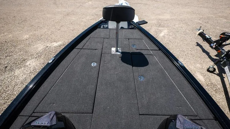 Slide: The Image of 2024 Lund 1875 Pro-V Bass XS boat deck with seating and storage compartments. - 26
