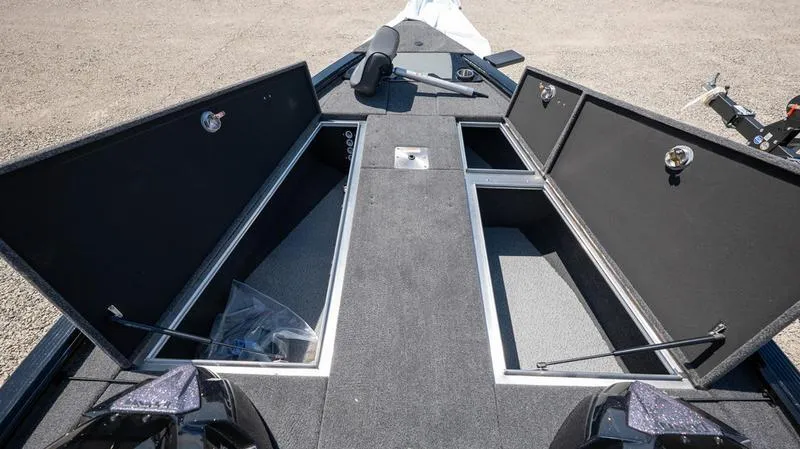 Slide: The Image of 2024 Lund 1875 Pro-V Bass XS boat with open storage compartments. - 27