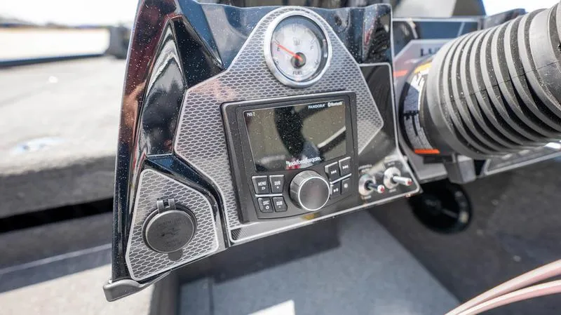 Slide: The Image of 2024 Lund 1875 Pro-V Bass XS dashboard with control panel and gauge. - 31