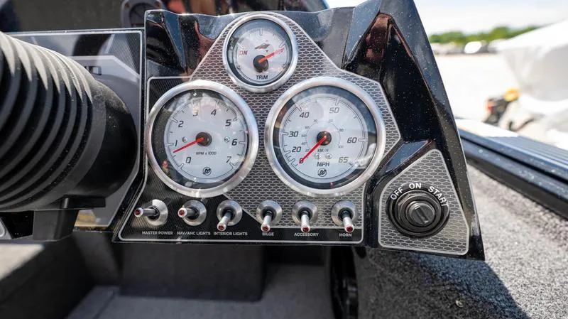 Slide: The Image of Dashboard of 2024 Lund 1875 Pro-V Bass XS boat with gauges and switches. - 32
