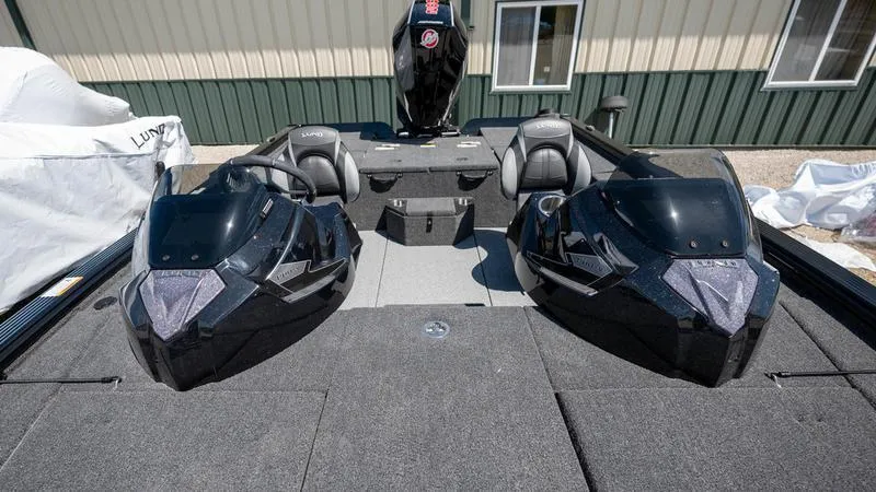 Slide: The Image of 2024 Lund 1875 Pro-V Bass XS boat interior with dual consoles and seating. - 4