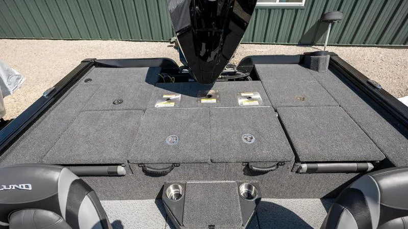 Slide: The Image of 2024 Lund 1875 Pro-V Bass XS boat interior with storage compartments and seating. - 9