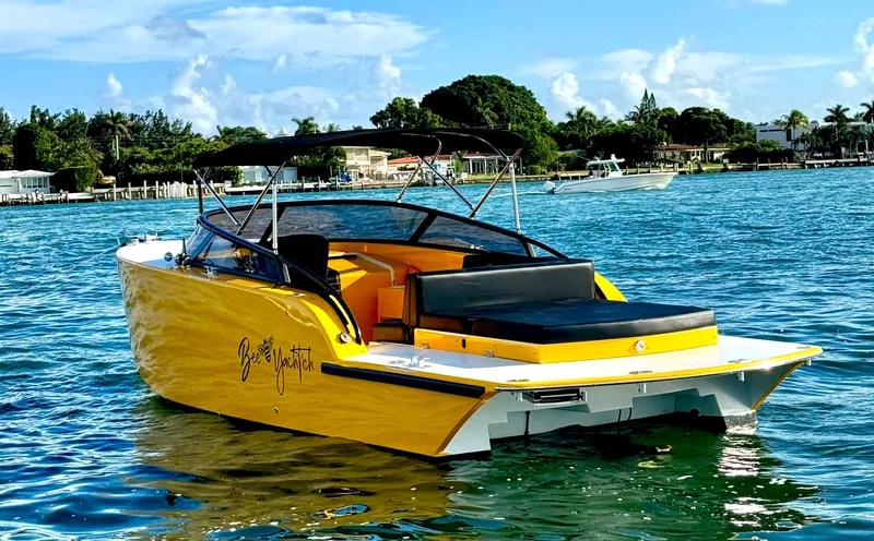 Slide: The Image of 2023 VanDutch Sport 35 boat in vibrant yellow on a sunny day. - 11