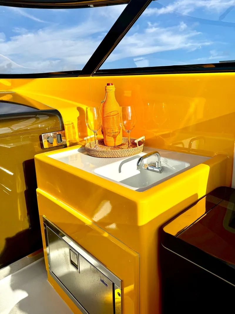 Slide: The Image of 2023 VanDutch Sport 35 yacht interior with sink and champagne setup. - 13