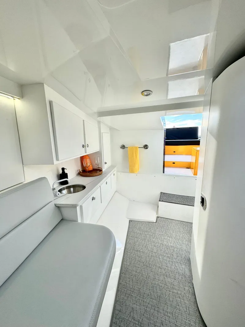 Slide: The Image of 2023 VanDutch Sport 35 interior cabin with modern amenities and sleek design. - 4