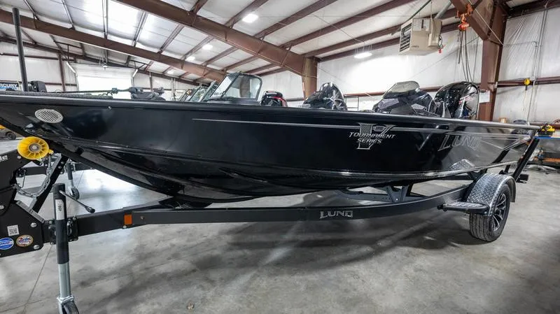 The Image of 2024 Lund 1875 Pro-V Bass XS boat in a warehouse. - 1