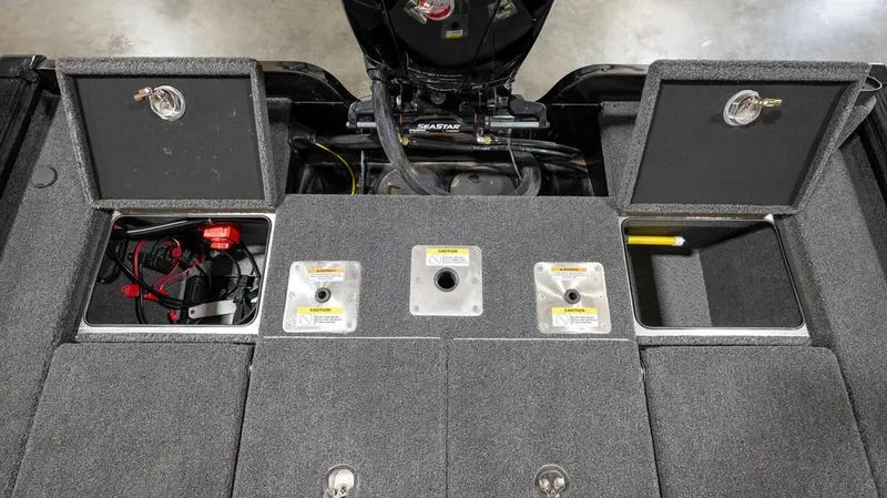 Slide: The Image of 2024 Lund 1875 Pro-V Bass XS boat storage compartments and engine. - 12