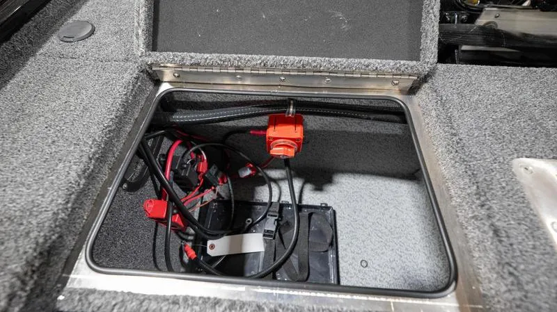 Slide: The Image of 2024 Lund 1875 Pro-V Bass XS battery compartment with wiring. - 14