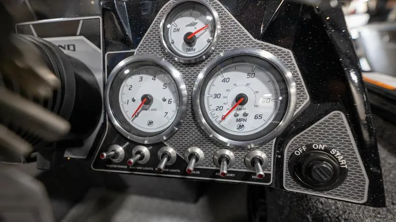 Slide: The Image of Dashboard of 2024 Lund 1875 Pro-V Bass XS boat with gauges and controls. - 21