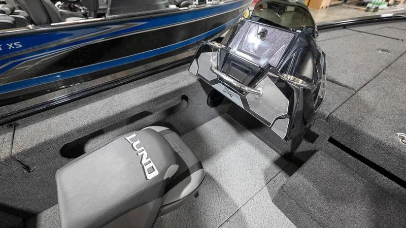 Slide: The Image of 2024 Lund 1875 Pro-V Bass XS interior, featuring seating and control console. - 22