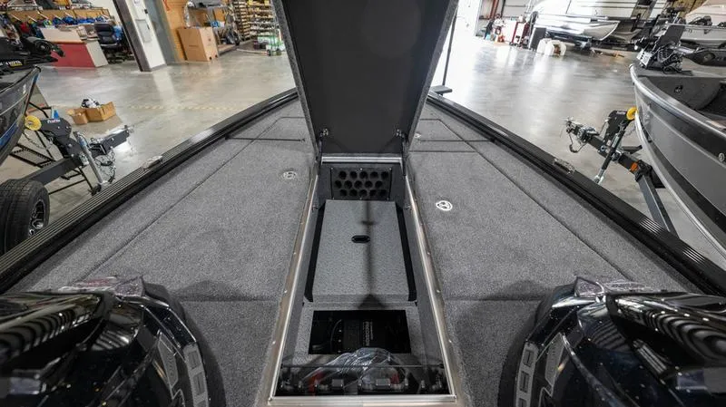Slide: The Image of 2024 Lund 1875 Pro-V Bass XS boat interior with open storage compartments. - 25
