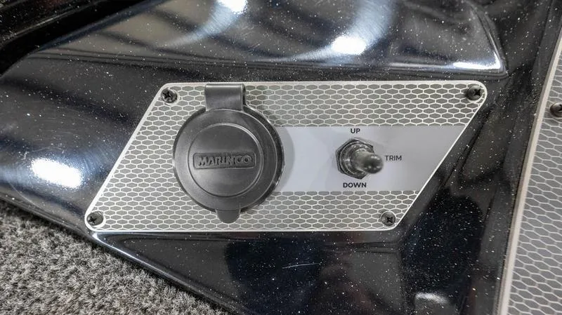 Slide: The Image of Close-up of 2024 Lund 1875 Pro-V Bass XS trim control switch. - 27