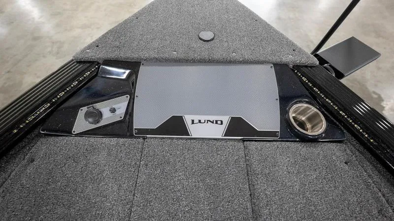 Slide: The Image of 2024 Lund 1875 Pro-V Bass XS boat deck with control panel and cup holder. - 28