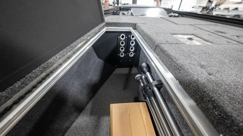 Slide: The Image of 2024 Lund 1875 Pro-V Bass XS storage compartment with rod holders. - 29