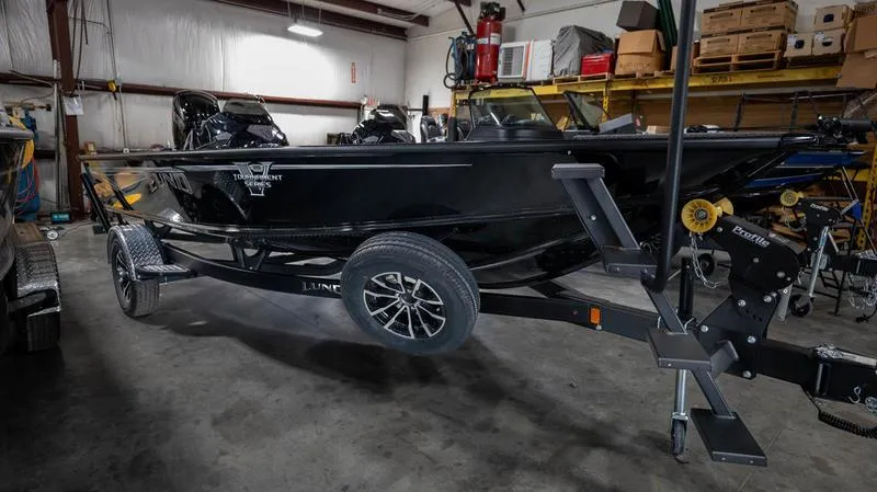 Slide: The Image of 2024 Lund 1875 Pro-V Bass XS boat in a storage facility. - 7