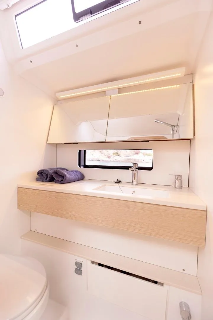 Slide: The Image of Modern bathroom in 2024 Dufour 41 yacht with sleek vanity and mirror. - 12