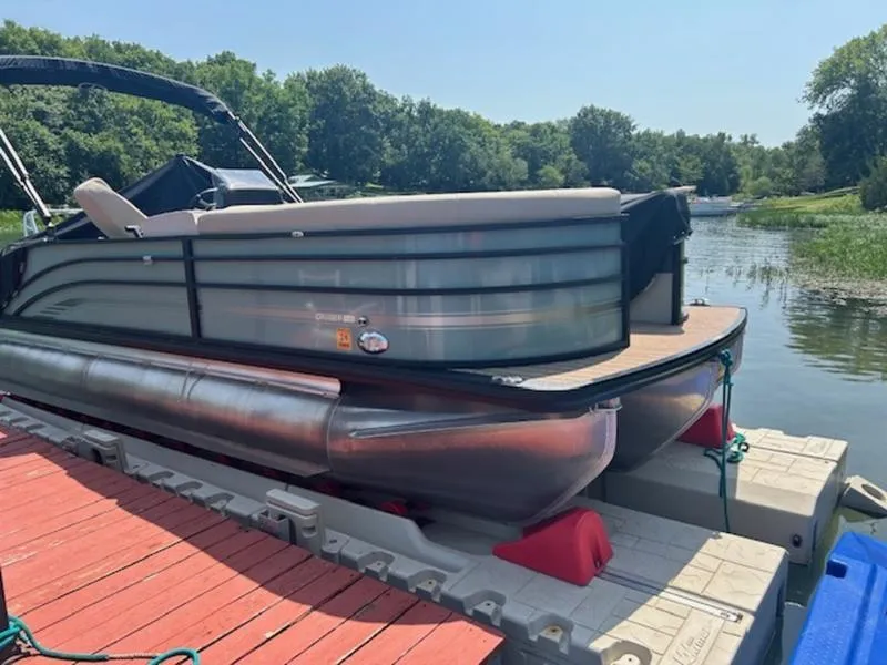 The Image of 2024 Harris Cruiser 230 SL pontoon boat at dock. - 0