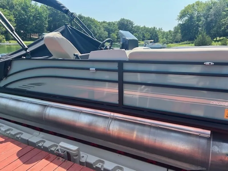 Slide: The Image of 2024 Harris Cruiser 230 SL pontoon boat at dock. - 3