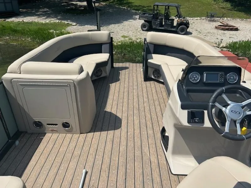 Slide: The Image of Interior of 2024 Harris Cruiser 230 SL with luxurious seating. - 4