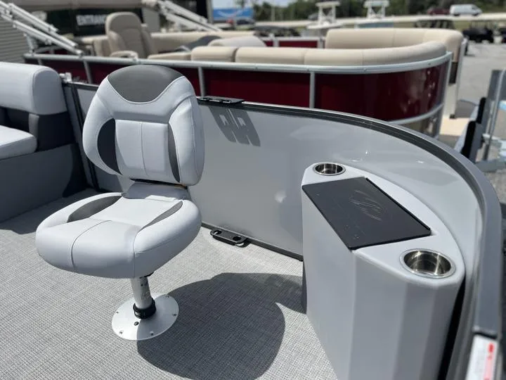 Slide: The Image of 2024 Bentley Pontoons LE 180 3 PT boat interior with swivel chair and cup holders. - 11