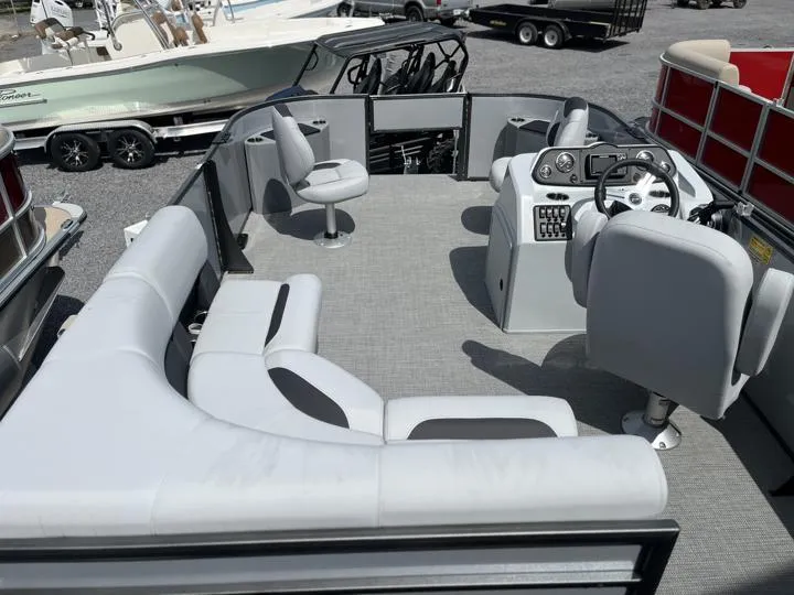 Slide: The Image of 2024 Bentley Pontoons LE 180 3 PT interior with gray seating and steering console. - 14