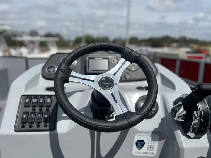 Slide: The Image of Steering wheel and dashboard of 2024 Bentley Pontoons LE 180 3 PT boat. - 15