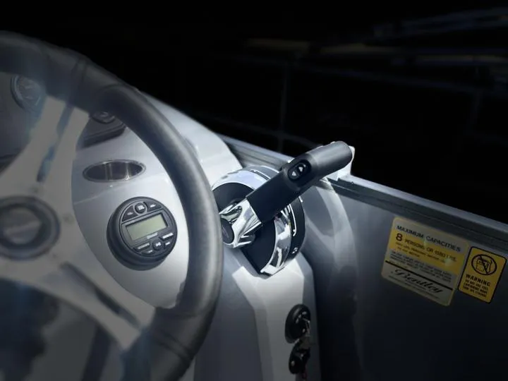 Slide: The Image of Close-up of 2024 Bentley Pontoons LE 180 3 PT steering wheel and throttle control. - 20