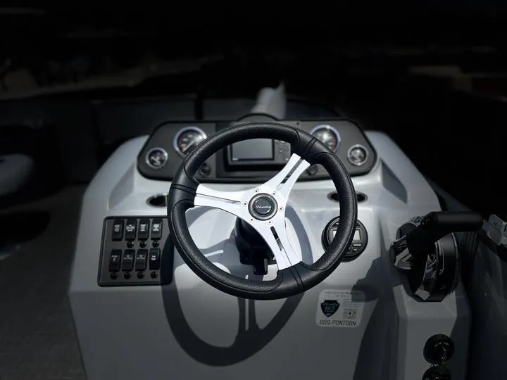 Slide: The Image of 2024 Bentley Pontoons LE 180 3 PT steering console with modern controls and gauges. - 22