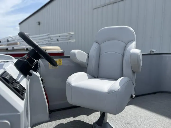 Slide: The Image of 2024 Bentley Pontoons LE 180 3 PT captain's chair and steering console. - 23