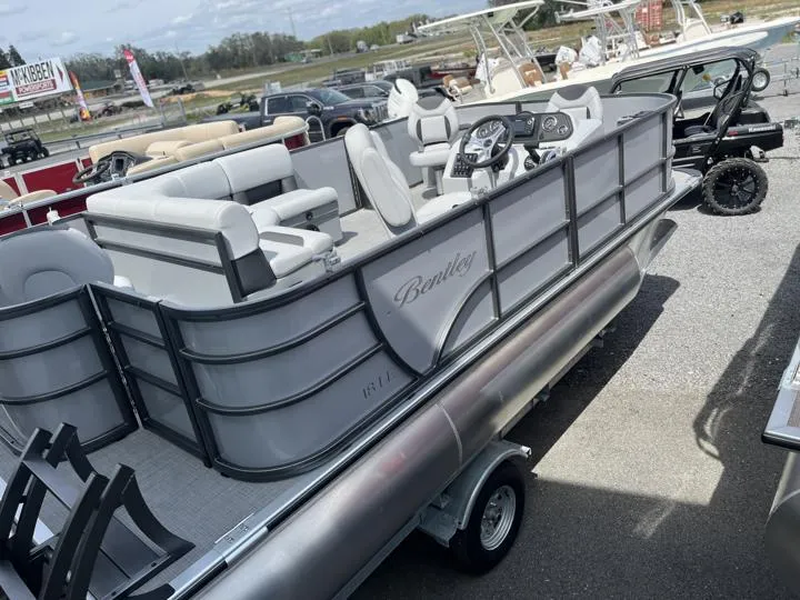 Slide: The Image of 2024 Bentley Pontoons LE 180 3 PT pontoon boat on trailer in dealership lot. - 5