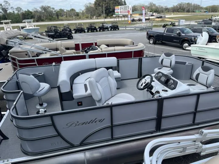 Slide: The Image of 2024 Bentley Pontoons LE 180 3 PT pontoon boat with luxurious seating and modern design. - 6