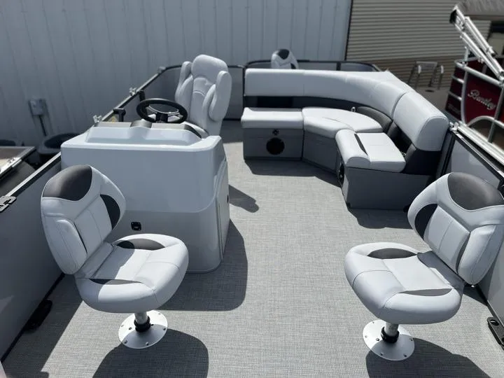 Slide: The Image of 2024 Bentley Pontoons LE 180 3 PT interior with plush seating and modern helm. - 9