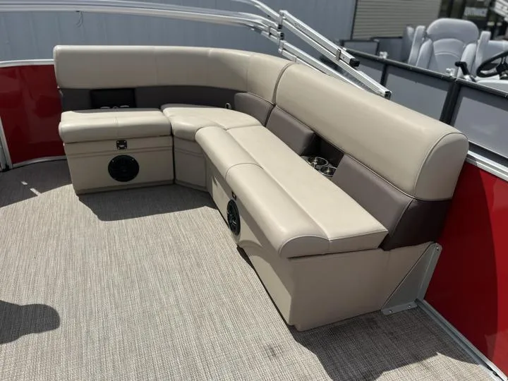 Slide: The Image of 2024 Bentley Pontoons LE 180 3 PT interior seating with beige and brown upholstery. - 13