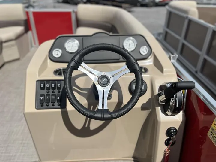 Slide: The Image of 2024 Bentley Pontoons LE 180 3 PT steering console with controls and gauges. - 17