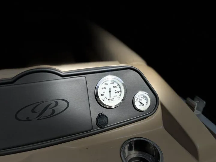 Slide: The Image of Dashboard of 2024 Bentley Pontoons LE 180 3 PT with gauges and logo. - 20