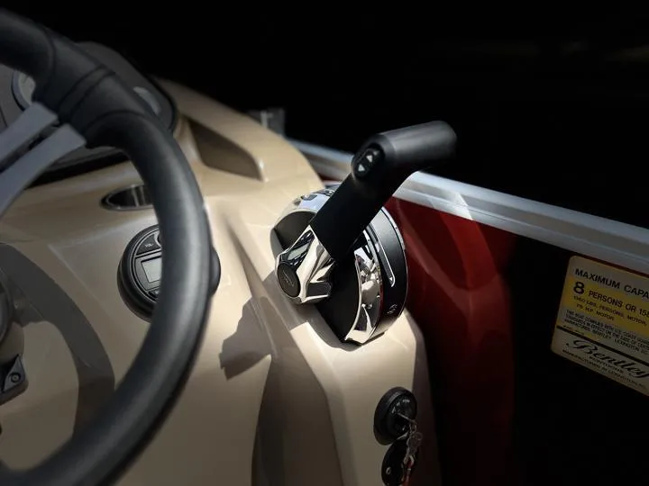 Slide: The Image of 2024 Bentley Pontoons LE 180 3 PT boat throttle control and steering wheel. - 22