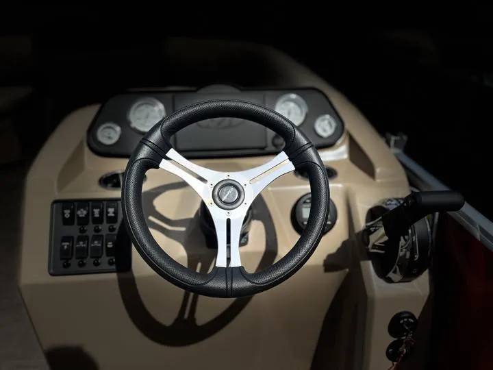 Slide: The Image of 2024 Bentley Pontoons LE 180 3 PT steering wheel and dashboard. - 23