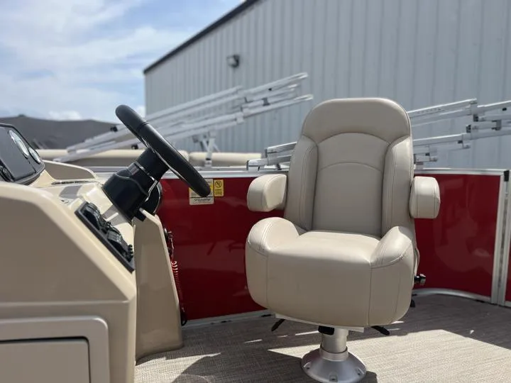 Slide: The Image of 2024 Bentley Pontoons LE 180 3 PT captain's chair and helm station. - 24