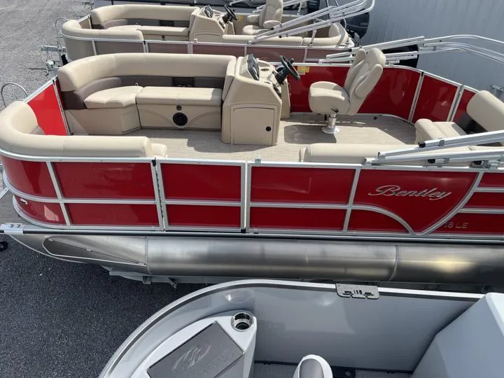 Slide: The Image of 2024 Bentley Pontoons LE 180 3 PT, red and beige pontoon boat, docked. - 4