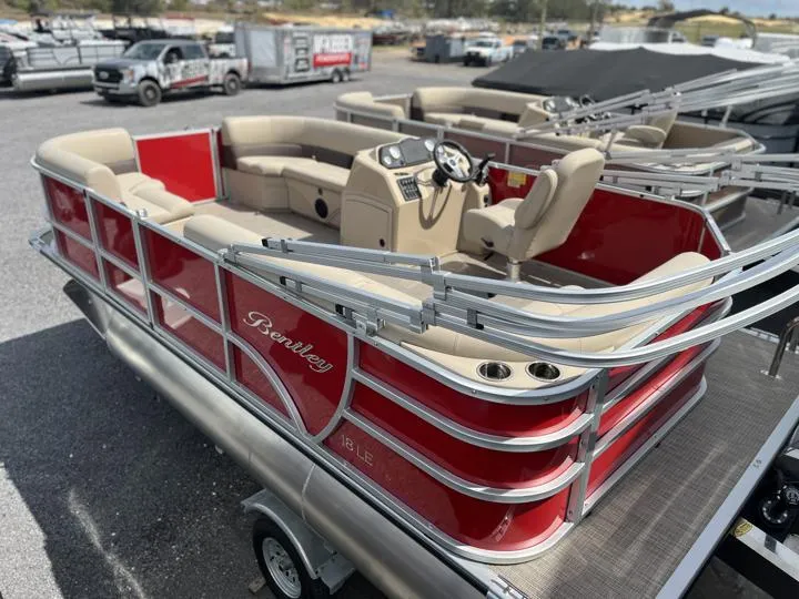 Slide: The Image of 2024 Bentley Pontoons LE 180 3 PT, red pontoon boat with beige seating. - 5