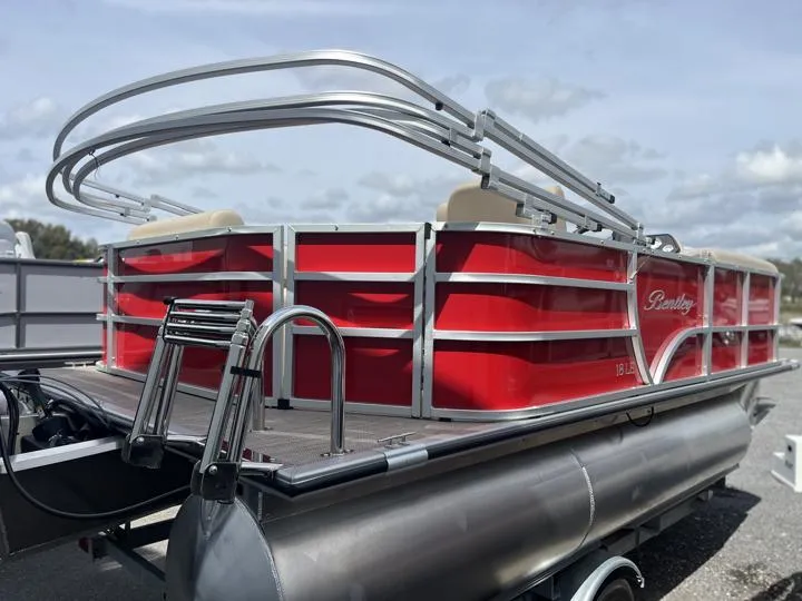 Slide: The Image of 2024 Bentley Pontoons LE 180 3 PT, red pontoon boat, rear view. - 6