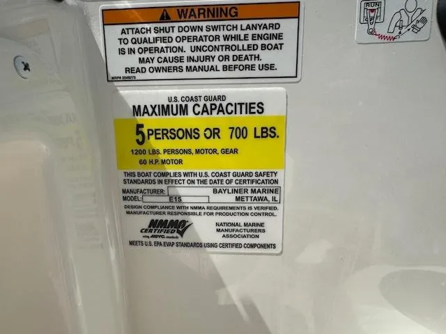 Slide: The Image of 2024 Bayliner Element M15 capacity label: 5 persons or 700 lbs, 60 HP motor. - 5