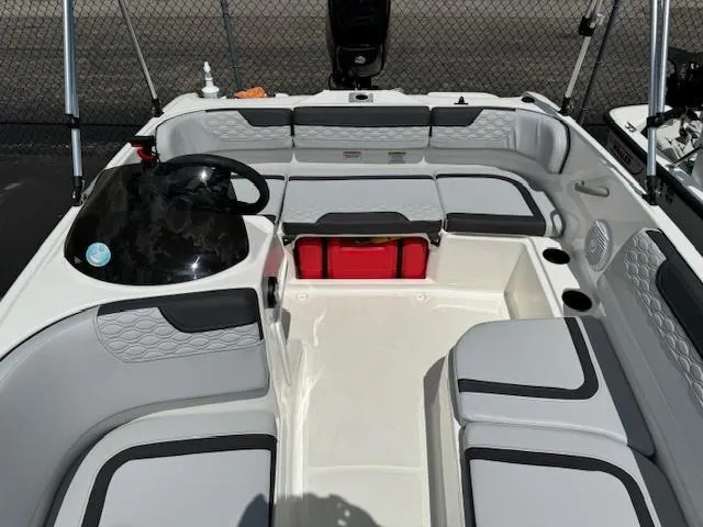 Slide: The Image of 2024 Bayliner Element M15 boat interior with seating and steering console. - 8