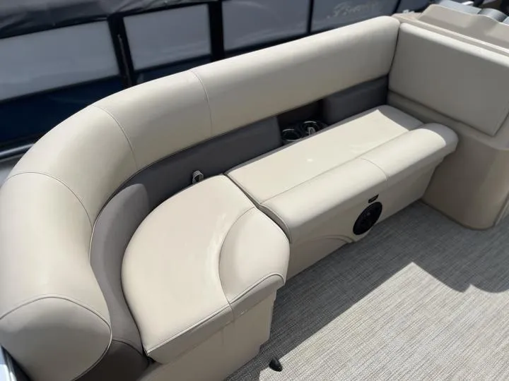 Slide: The Image of 2024 Bentley Pontoons LE 180 CR interior seating with beige upholstery. - 11