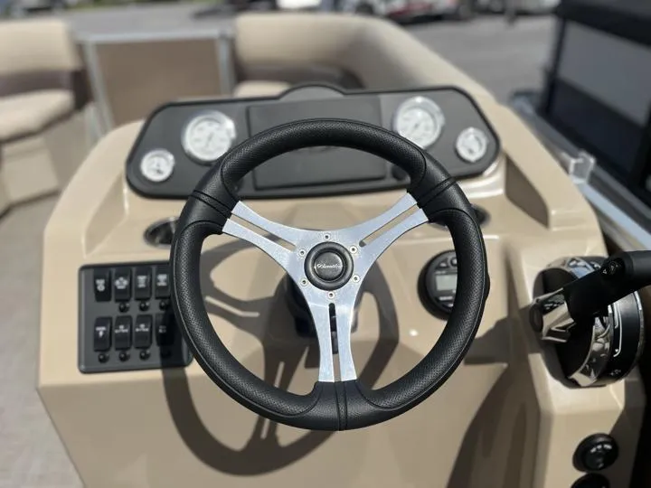Slide: The Image of 2024 Bentley Pontoons LE 180 CR steering wheel and dashboard. - 24