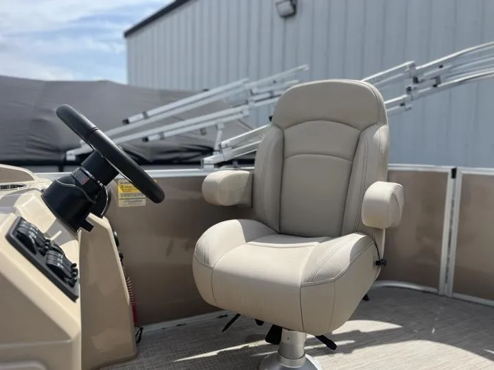 Slide: The Image of 2024 Bentley Pontoons LE 180 CR captain's chair and helm. - 25