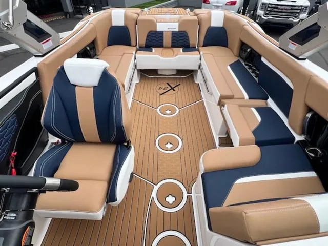 Slide: The Image of 2024 MasterCraft X24 boat interior with luxurious seating and stylish design. - 21
