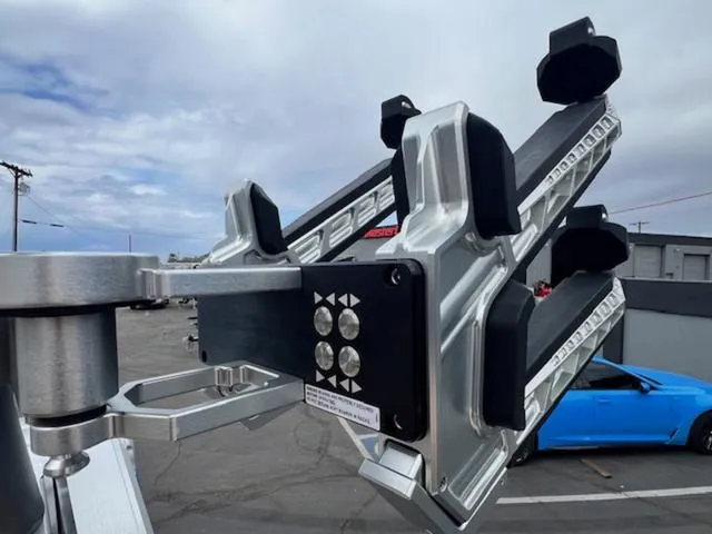 Slide: The Image of 2024 MasterCraft X24 wakeboard rack with LED lights, showcasing sleek design and functionality. - 22